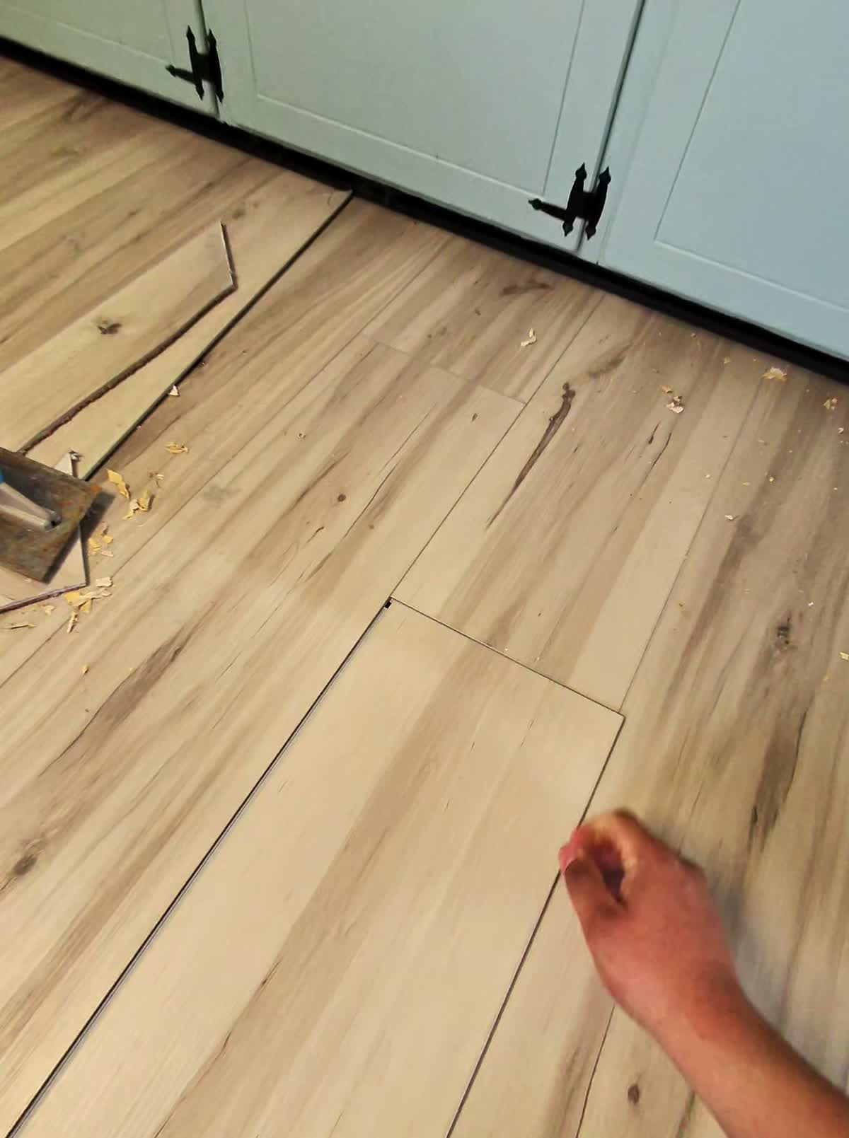 Installing click-lock luxury vinyl plank flooring in a kitchen
